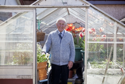 Wullie Wood, retired fisherman, in his green house in May 2013.